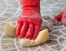 man's hand cleaning floor