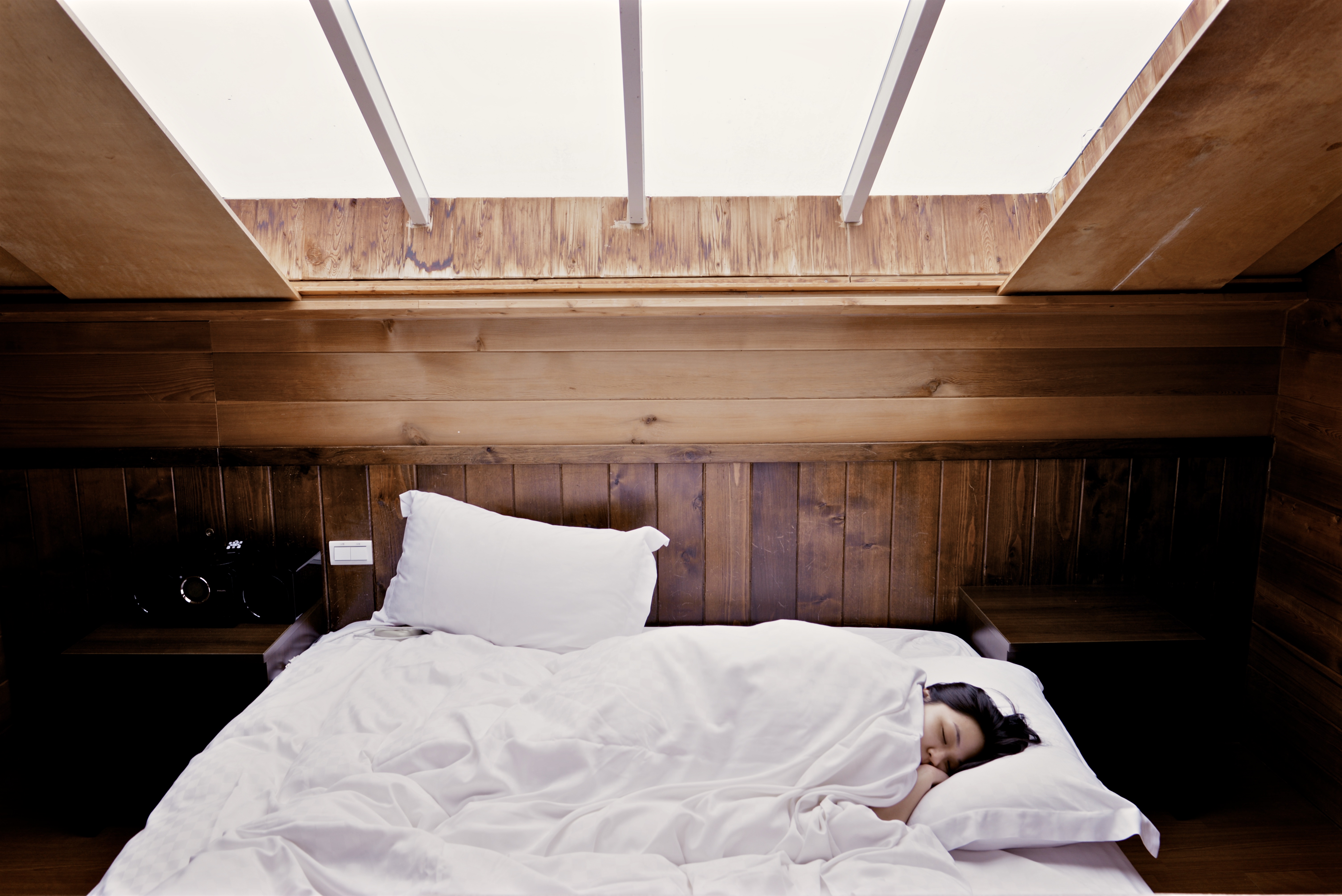 woman sleeping on bad